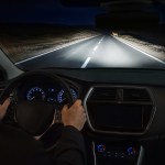 Driver checking an automotive thermal night vision display before buying a system
