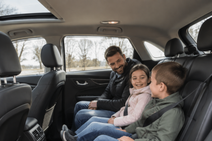 Driver checking legroom and car interior space from the front seat